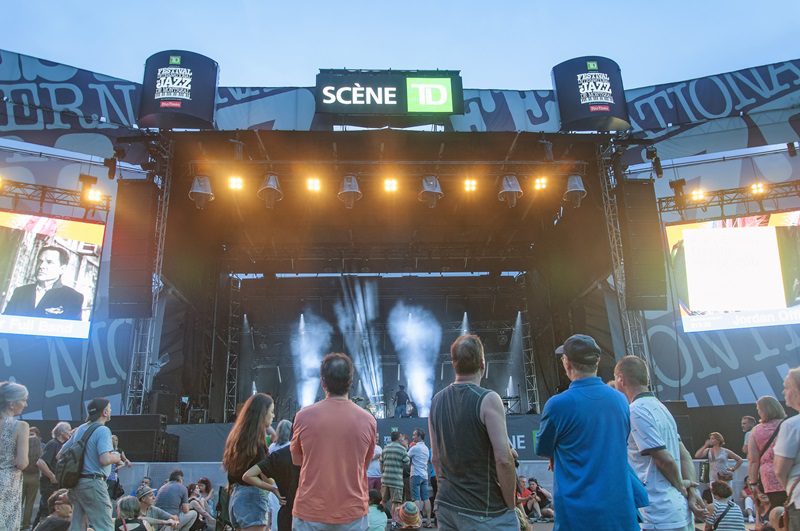 Montreal, Canada. July 5, 2019. people outside watching the Montreal Jazz Festival at night in Canada.