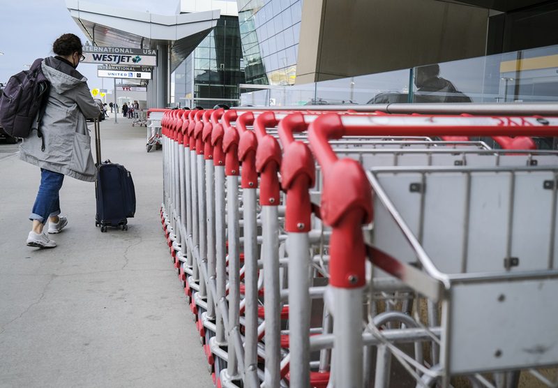 The Calgary International Airport says parts of its domestic terminal building are closed due to damage caused by hail and heavy rainfall. Passengers arrive for flights at Calgary International Airport in Calgary, Monday, Oct. 10, 2022. THE CANADIAN PRESS/Jeff McIntosh