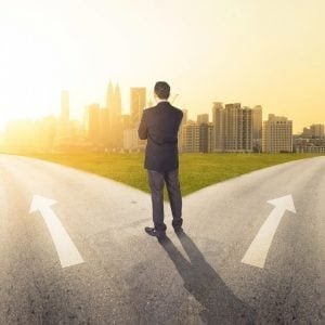 businessman at a fork in the road