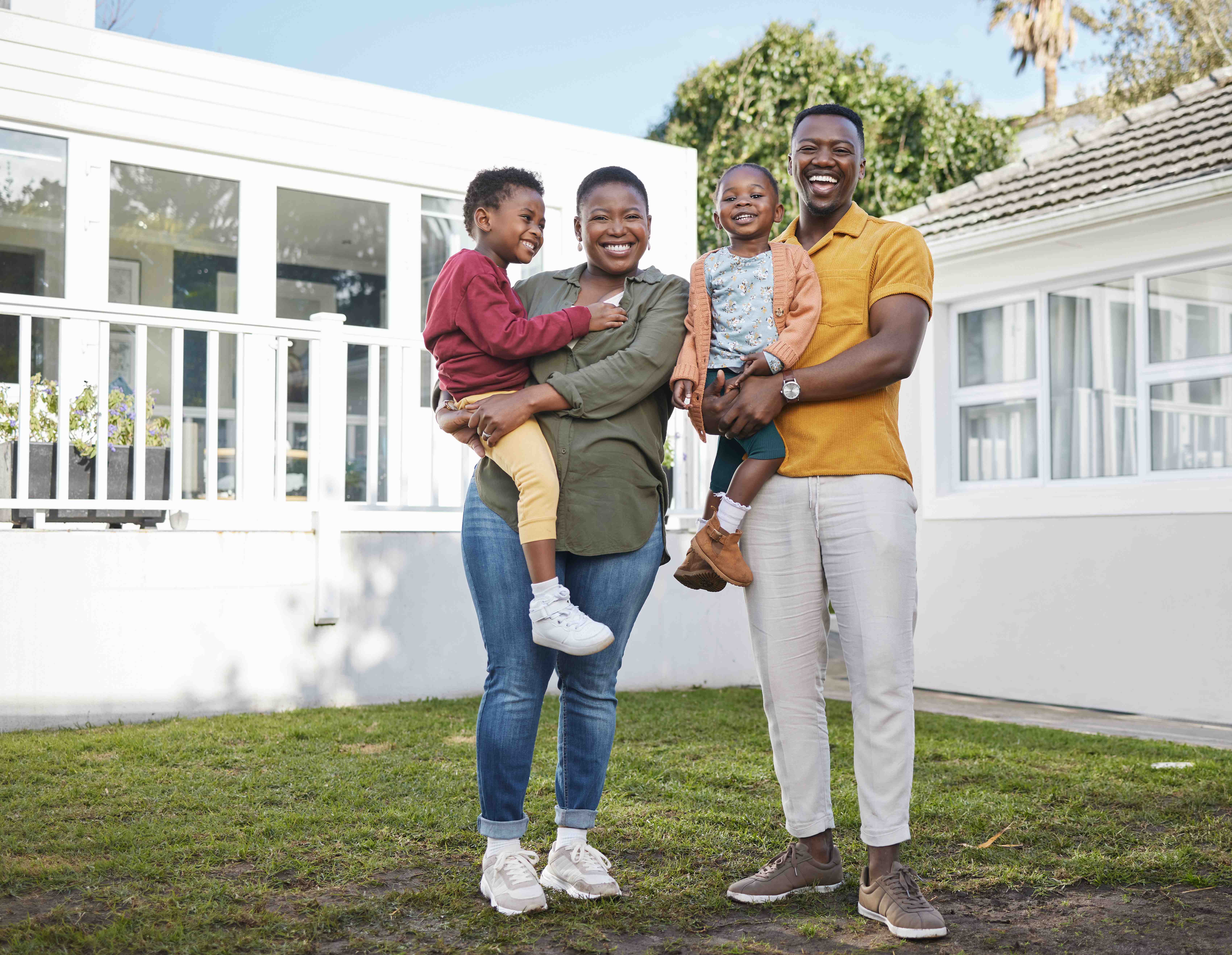 Happy Family in Their New Home - a foreign insurance company doing business in florida