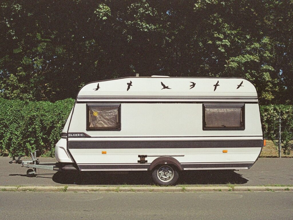 Small caravan parked on the side of the road