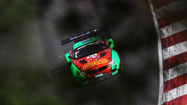 A photo of racing driver Phil Keen on track in a BMW. 