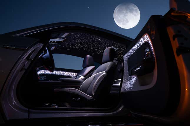 Interior of the rainbow Rolls-Royce Spectre Lunaflair with the door open