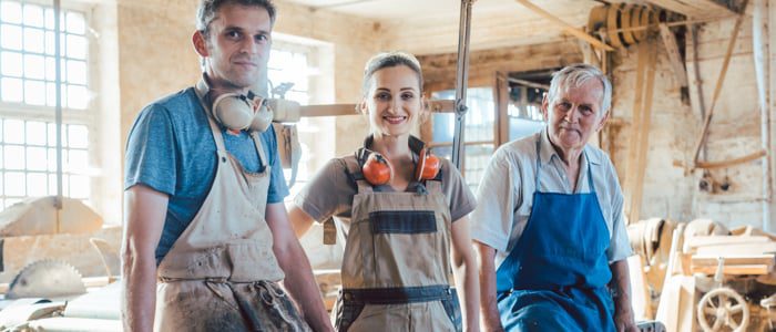 Carpenter family business with generations in the workshop having a break