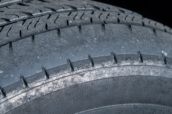 Worn tire treads on a car