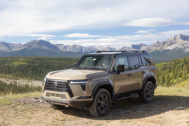 Front 3/4 view of a beige Lexus GX 550 in the wilderness