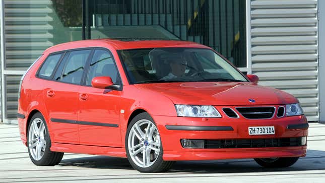 A photo of a red Saab 9-3 station wagon. 