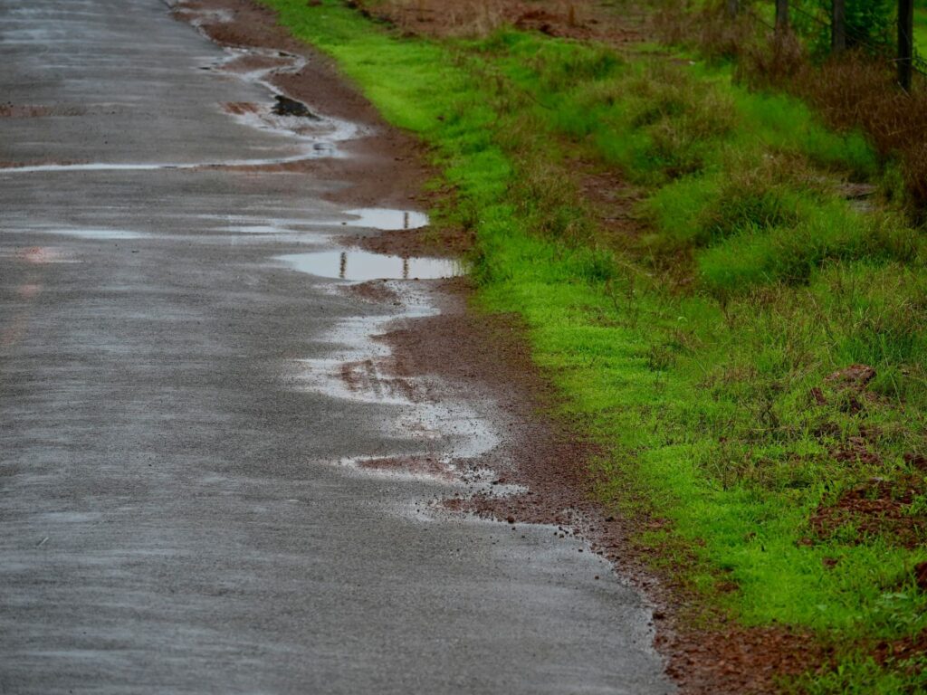 Country road with puddles 