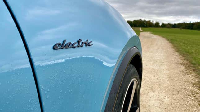 a photo of the cursive Electric script on the front quarter panel of the Macan