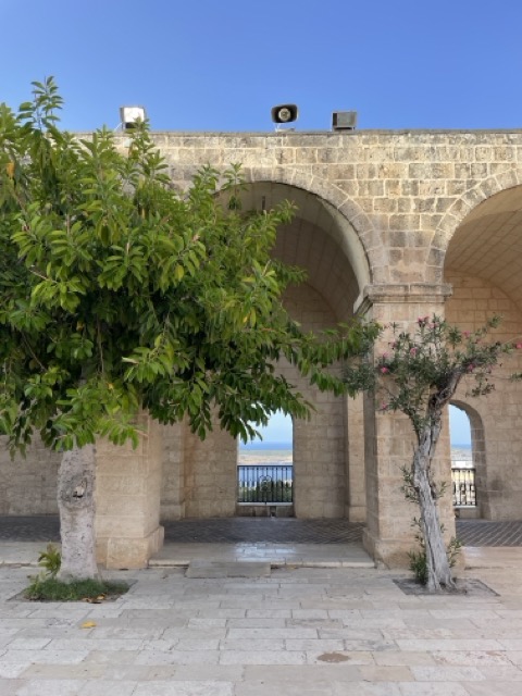 Image of views through stone wall out to sea Mellieha, Malta ©Kerry McCarthy 