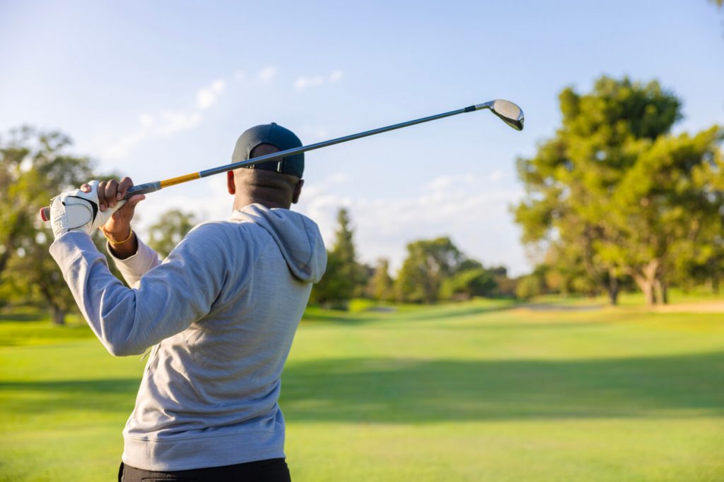 how to stop topping the golf ball