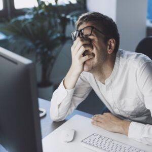 Frustrated man at computer