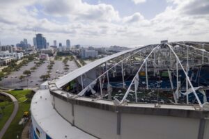 The roof of the Tropicana Field is damaged the morning after Hurricane Milton hit the region, Thursday, Oct. 10, 2024, in St. Petersburg, Fla. THE CANADIAN PRESS/AP-Julio Cortez