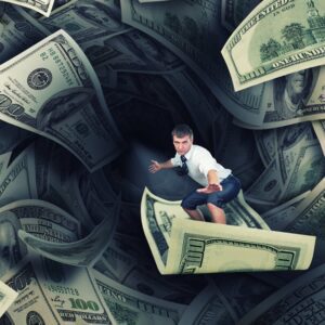 Businessman surfing on a $100 bill