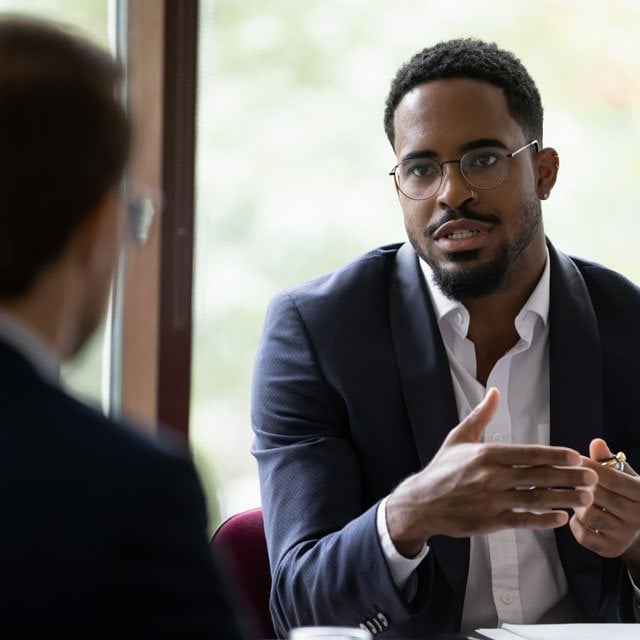 Two men talking to each other