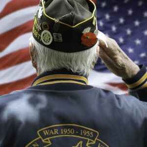 Veteran saluting flag