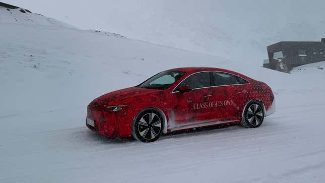 Front 3/4 view of a camouflaged Mercedes-Benz CLA EV prototype