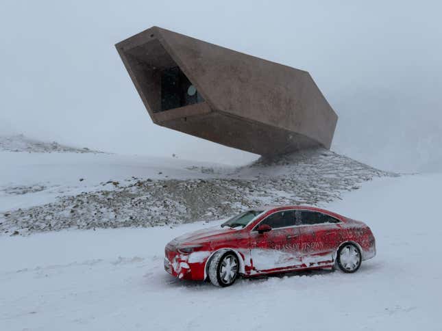 Side view of a camouflaged Mercedes-Benz CLA EV prototype