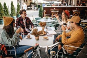 Friends drinking coffee at an outdoor cafe