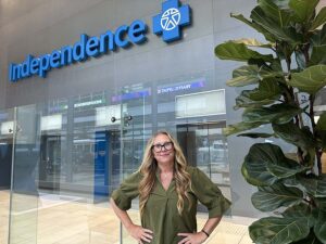 Melissa Mocharnuk, standing in the lobby of the IBX headquarters