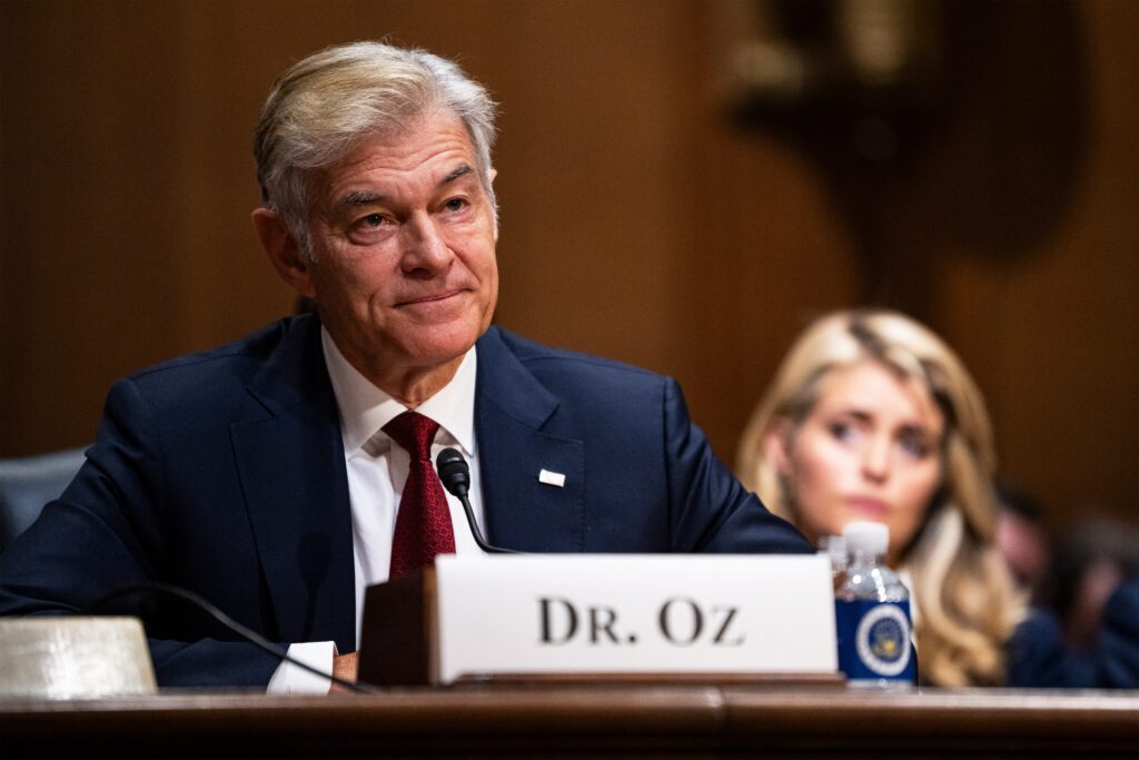 A photo of Mehmet Oz sitting in a Senate hearing room.